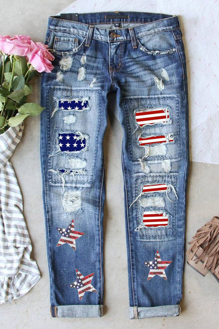 a pair of ripped jeans with american flags on them