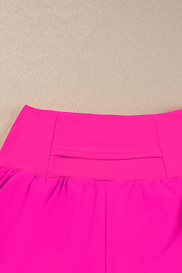 a bright pink skirt laying on the ground