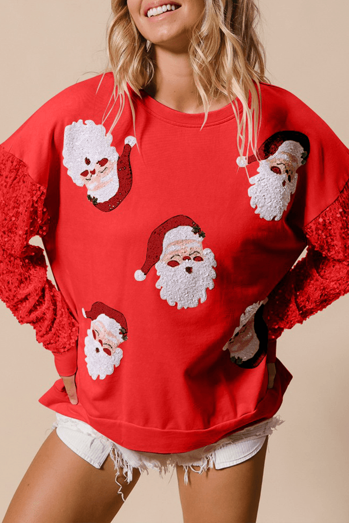 Red Moonlight Jade Christmas sweatshirt with white sequin Santa faces and red glitter sleeves, festive winter top from Faith & Co. Boutique.