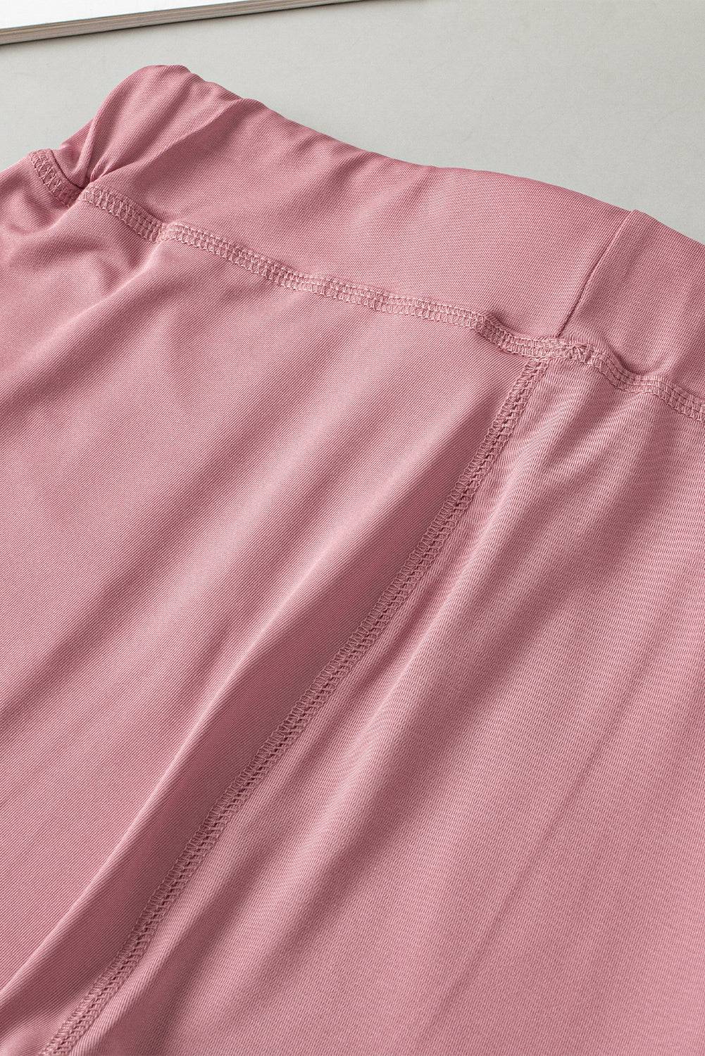 a close up of a pink shirt on a table