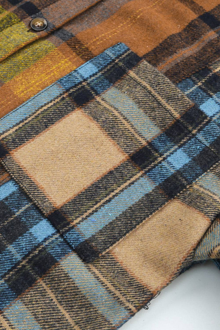 a close up of a plaid shirt with buttons