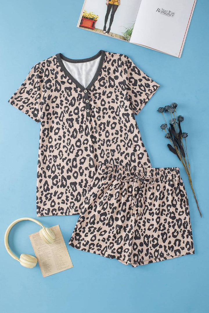 a women's leopard print pajamas and headband on a blue background