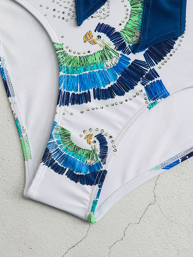 a close up of a white shirt with blue and green designs on it