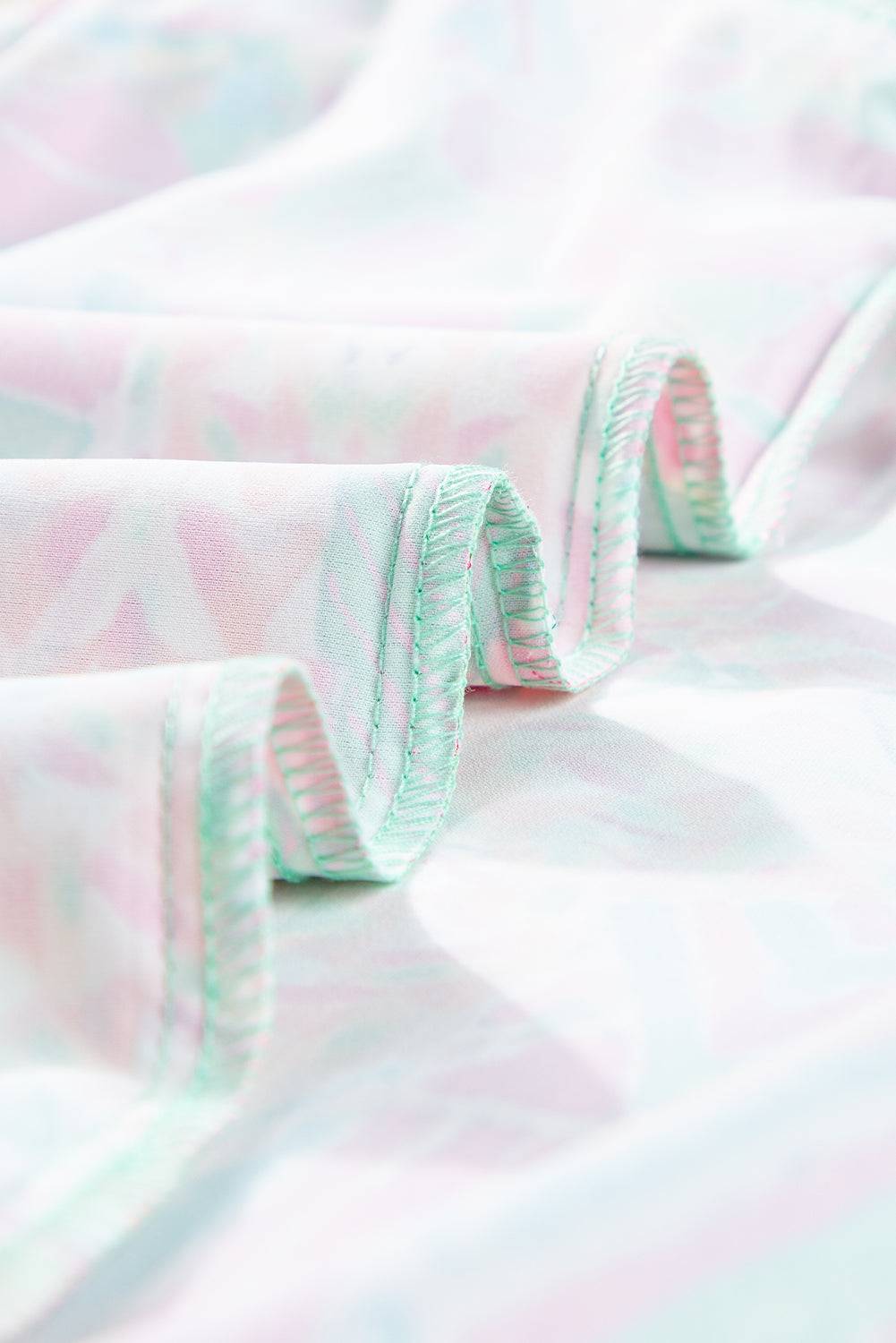 a close up of a pink and white fabric