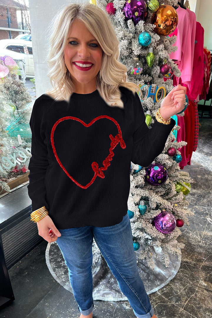 a woman standing in front of a christmas tree