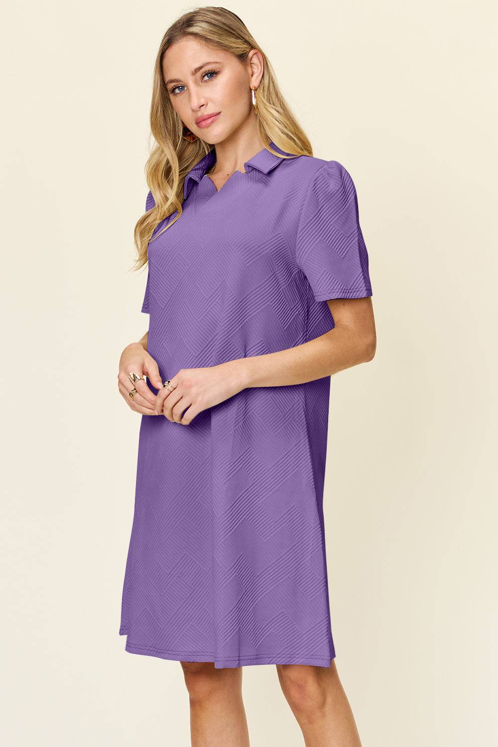 a woman wearing a purple dress