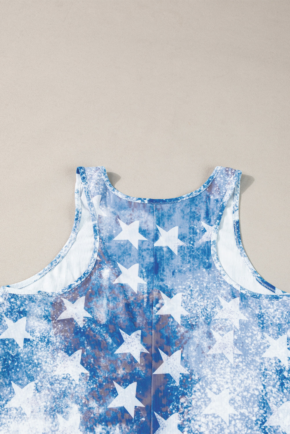a blue and white tank top with stars on it