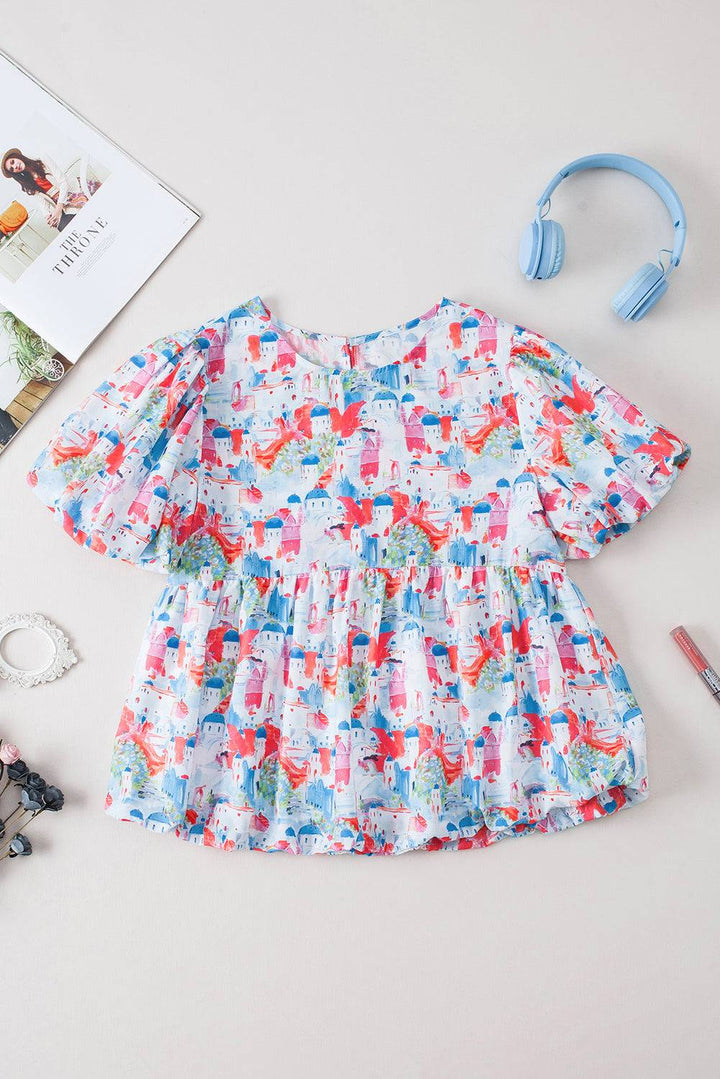 a baby girl's dress and headphones are on a table