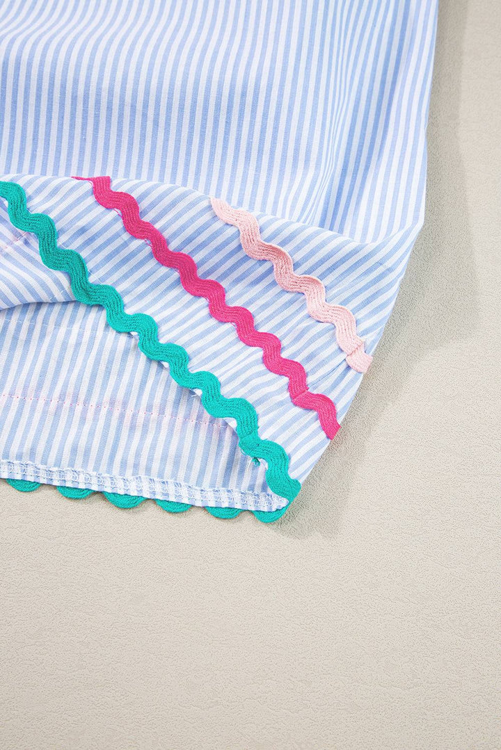 a close up of a blue and white striped shirt