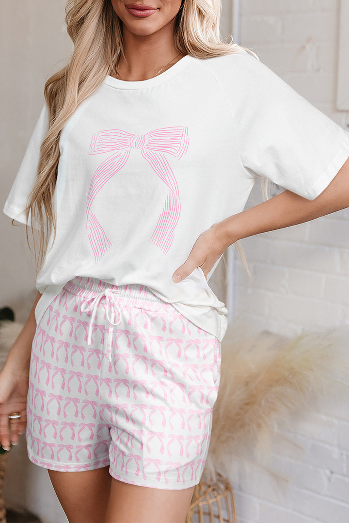 Side view of Pink Bow Knot Print Loose Fit Two Piece Casual Lounge Set featuring soft fabric and feminine bow design, perfect for Valentine's Day lounging at Faith & Co. Boutique.