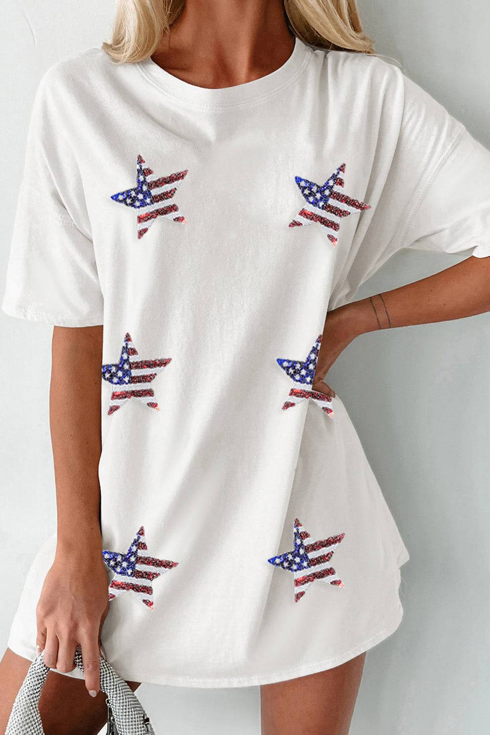 a woman wearing a white shirt with american flags on it