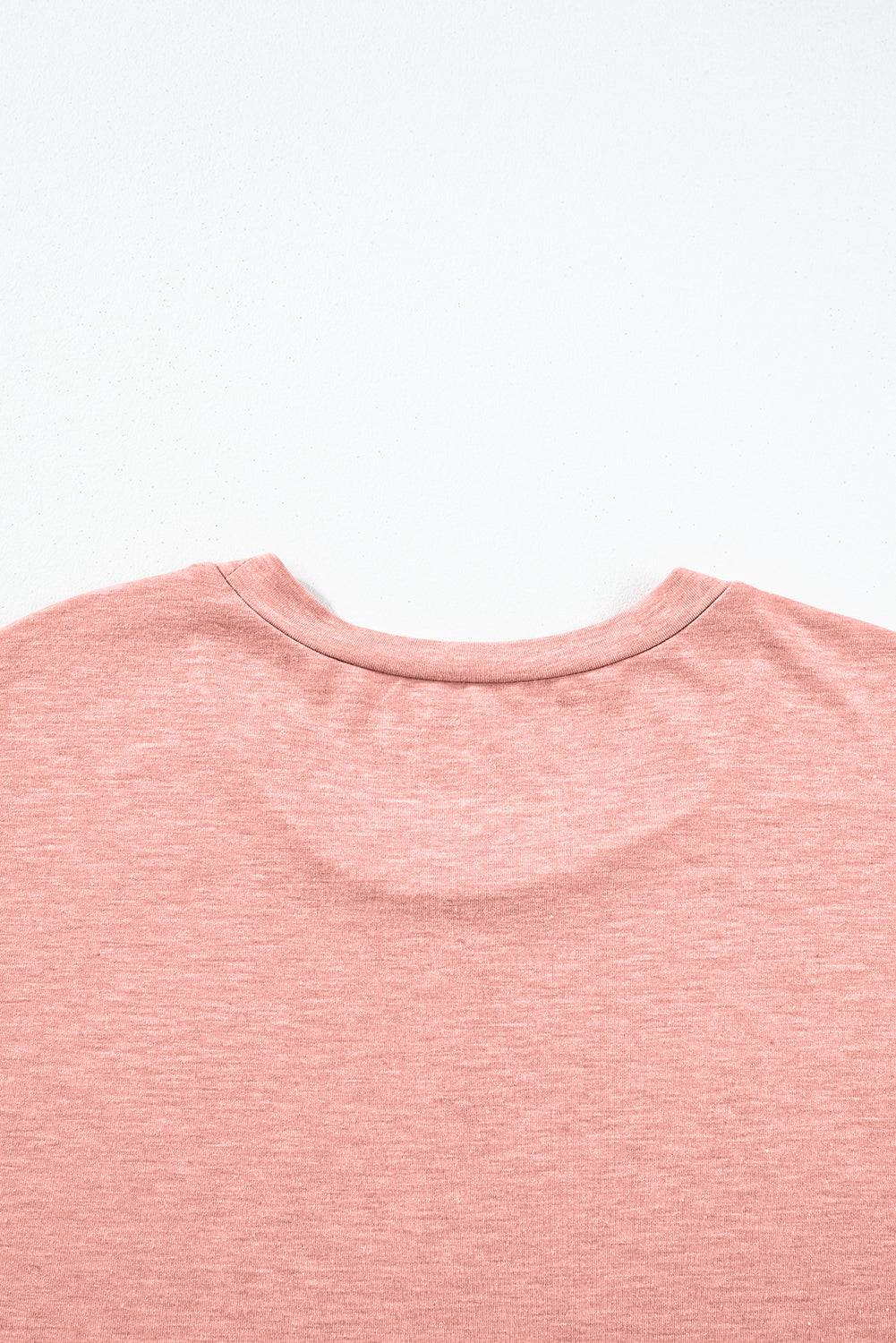 a close up of a pink shirt on a white background