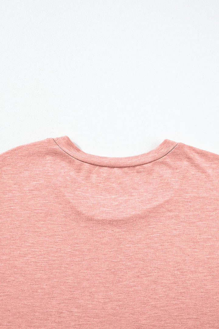 a close up of a pink shirt on a white background