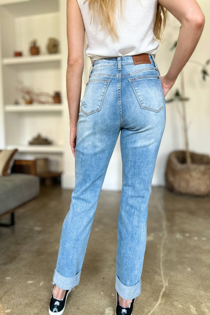 a woman in a white shirt and jeans