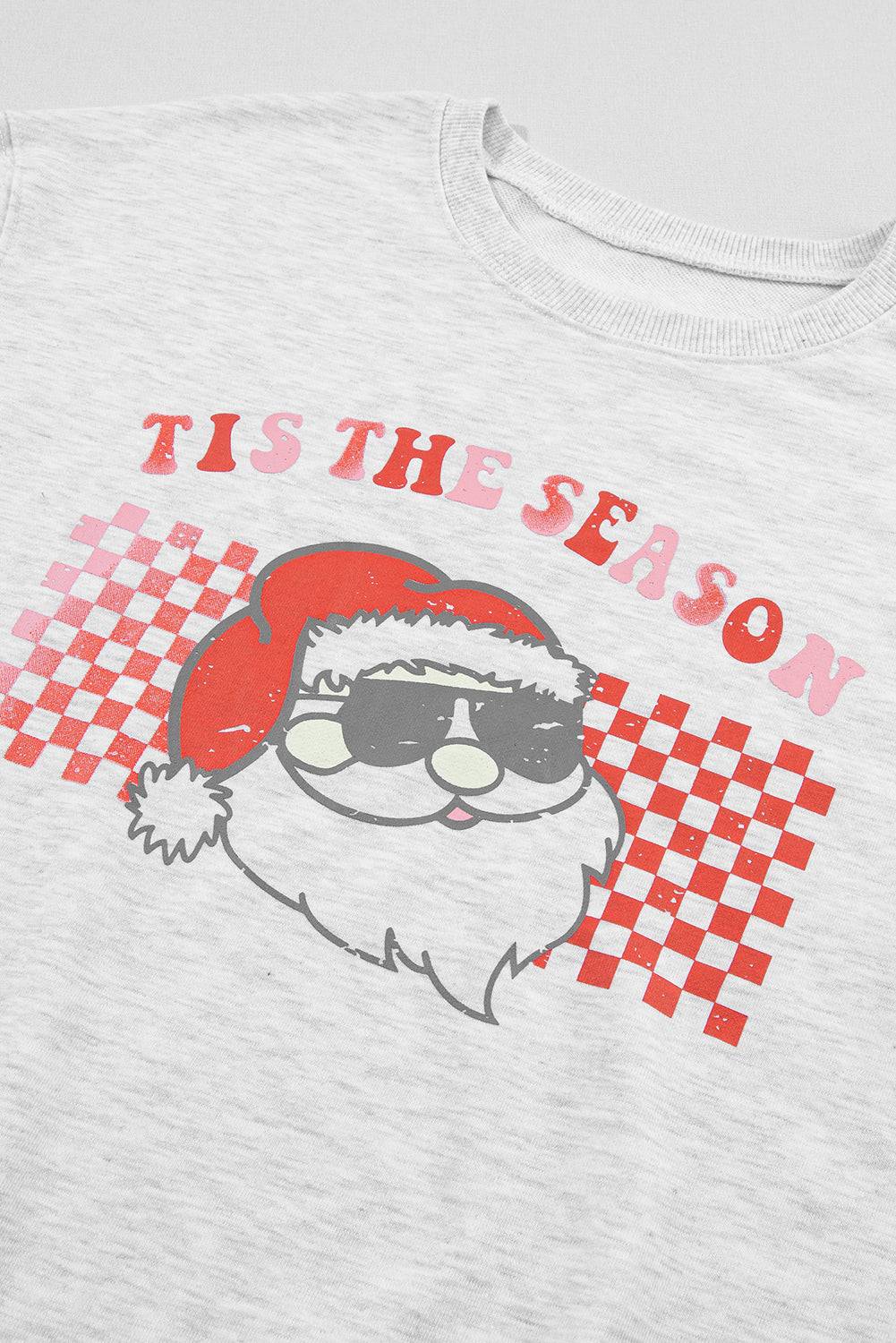 a white t - shirt with a santa clause on it