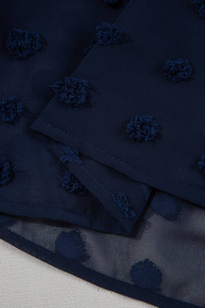 Close-up of hemline on Navy Blue Dotty Textured Notched Neck Plus Ruffled Dress, highlighting sheer Swiss dot fabric texture.