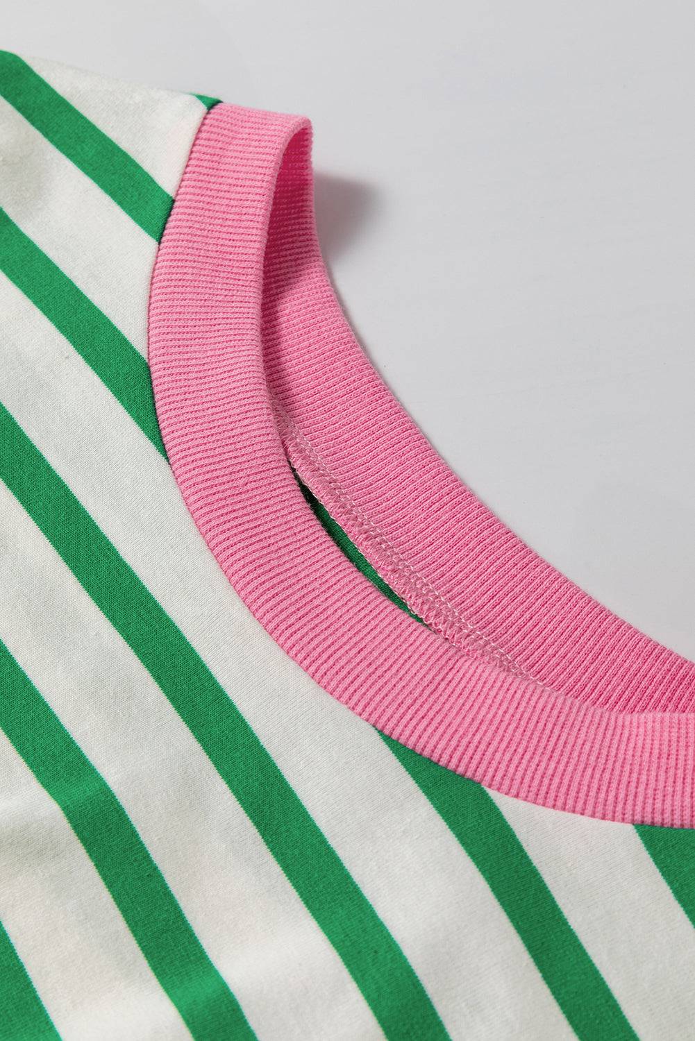 a close up of a pink and green striped shirt