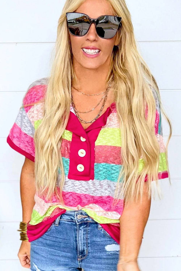 a blonde woman wearing sunglasses and a colorful shirt