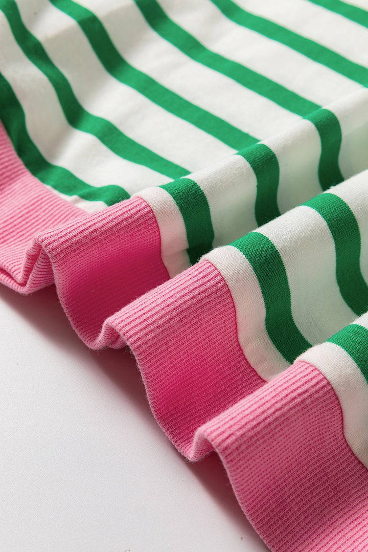 a close up of a pink and green striped shirt