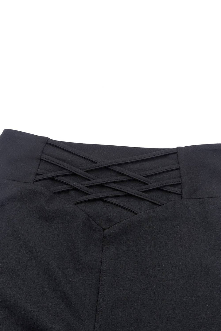 a close up of a black pants with a tie on it