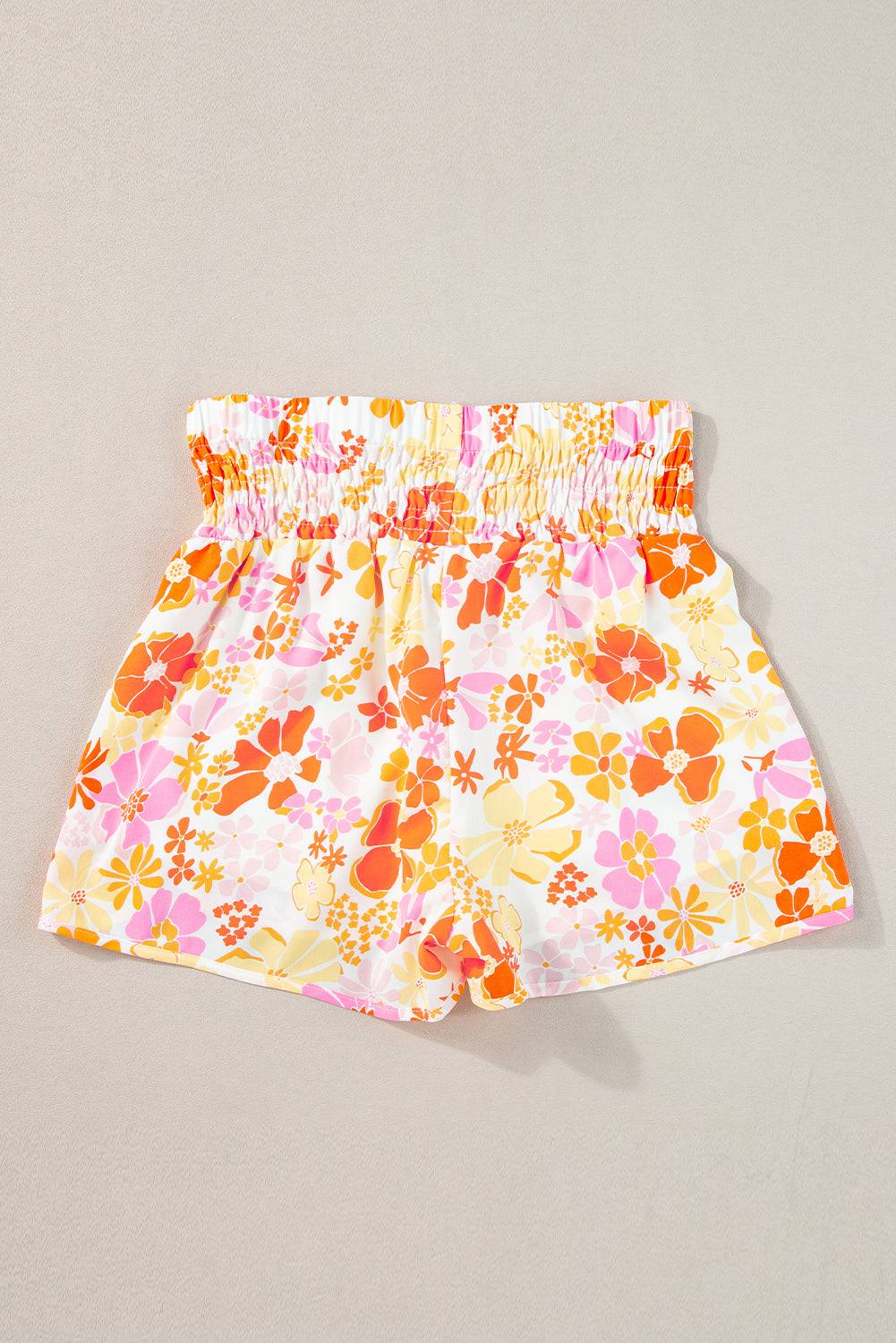 a pair of yellow and pink floral shorts