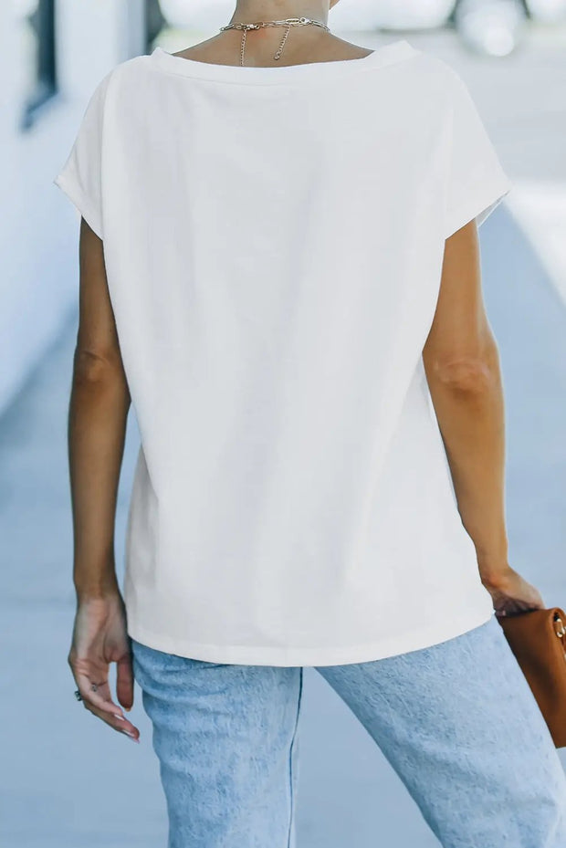 a woman wearing a white shirt and jeans