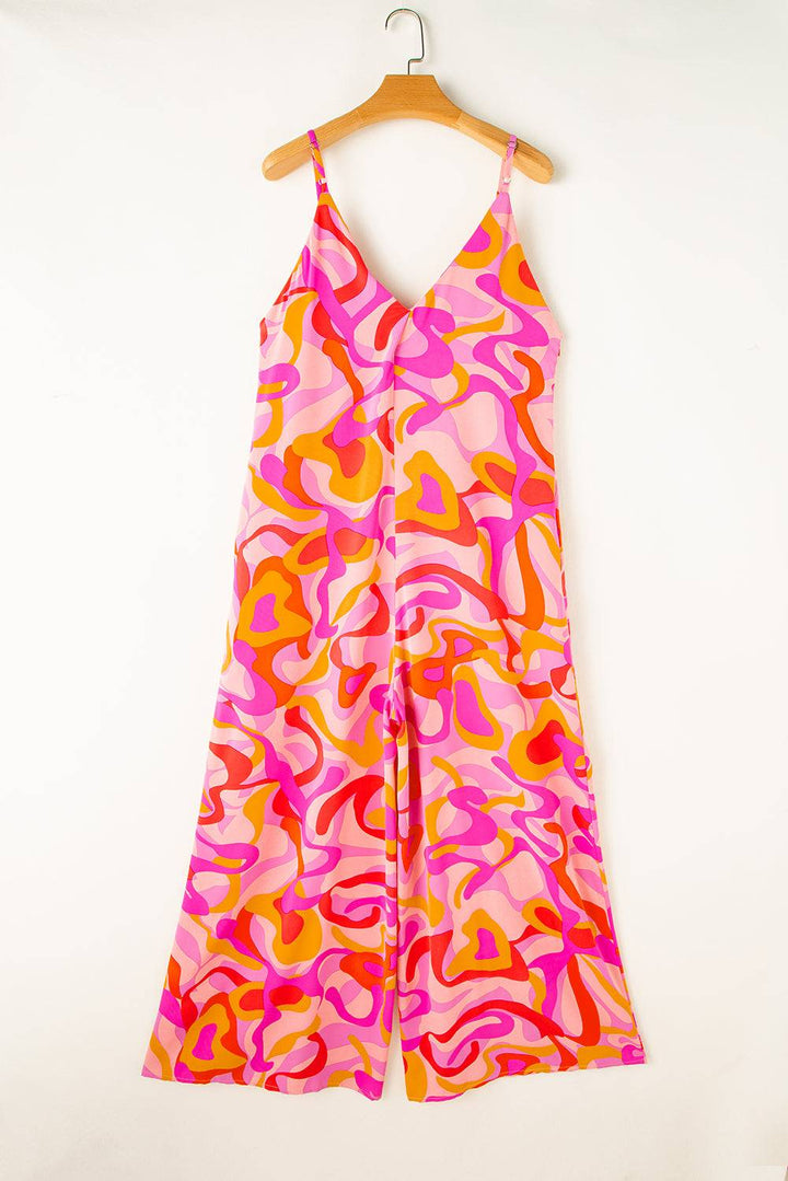 a pink and orange dress hanging on a hanger