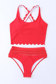 a red and white swimsuit with scalloped straps