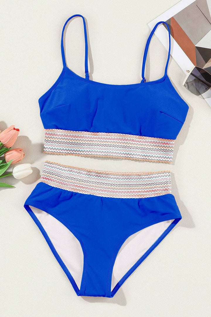 a women's blue and white two piece swimsuit