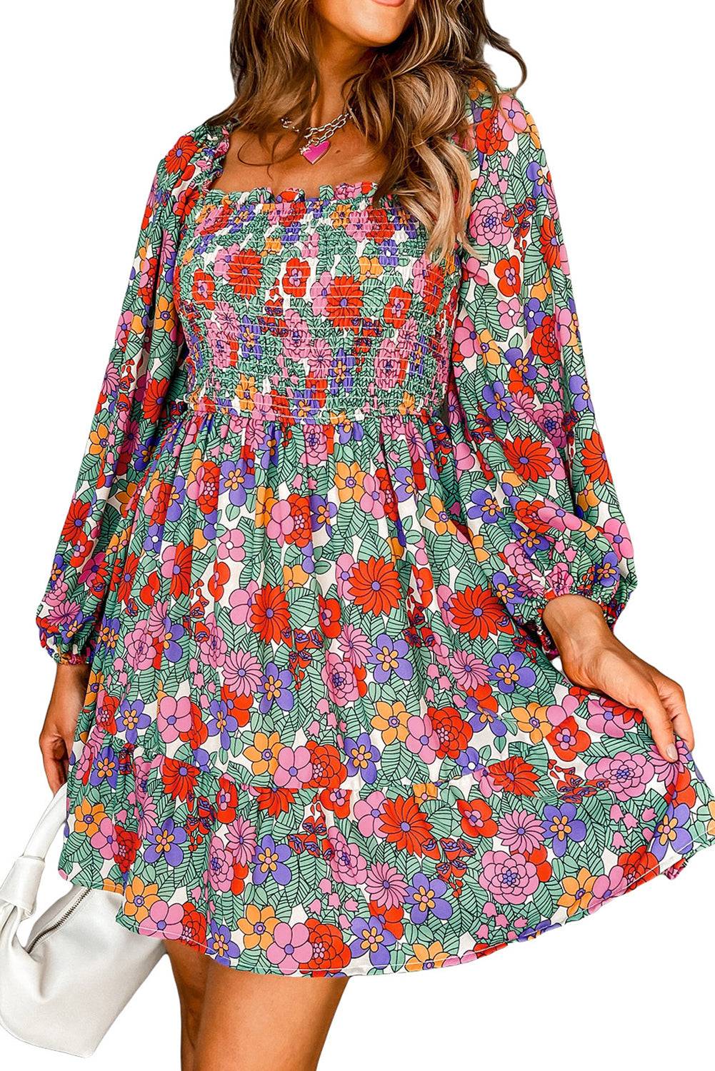 a woman wearing a colorful floral print dress