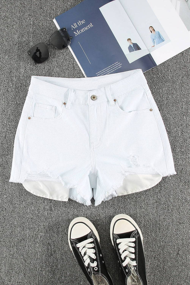 a pair of white shorts and a pair of black and white sneakers