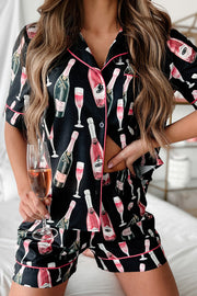 a woman in pajamas holding a glass of wine