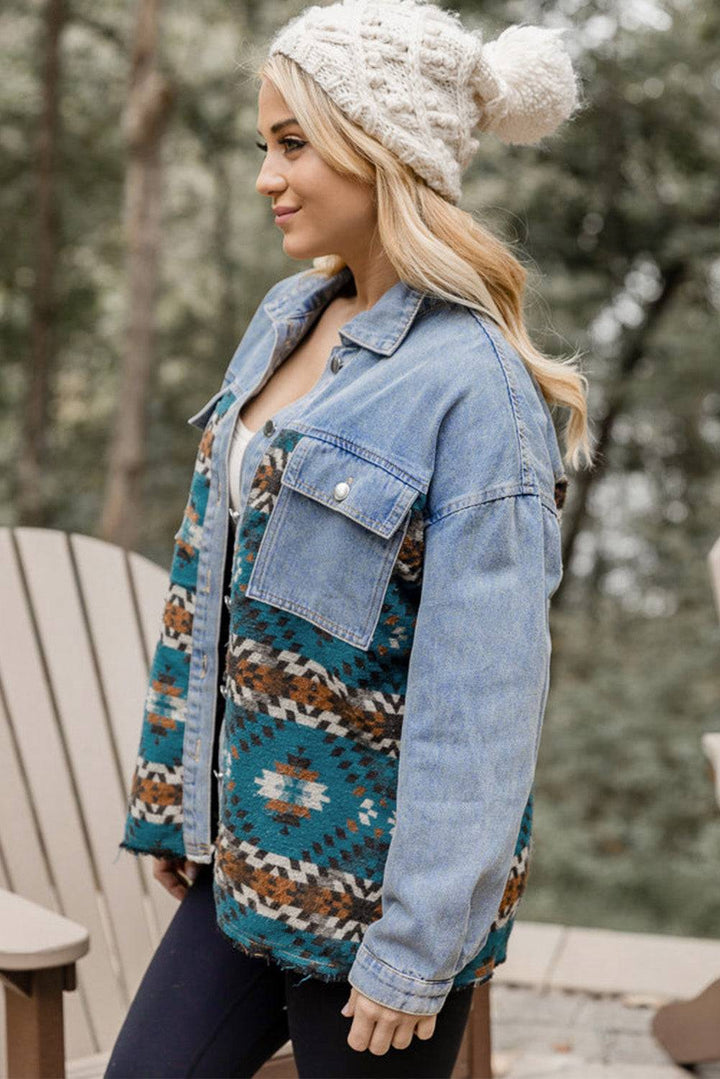 a woman wearing a denim jacket and a white hat