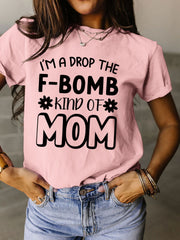 a woman wearing a pink t - shirt that says i'm a drop the
