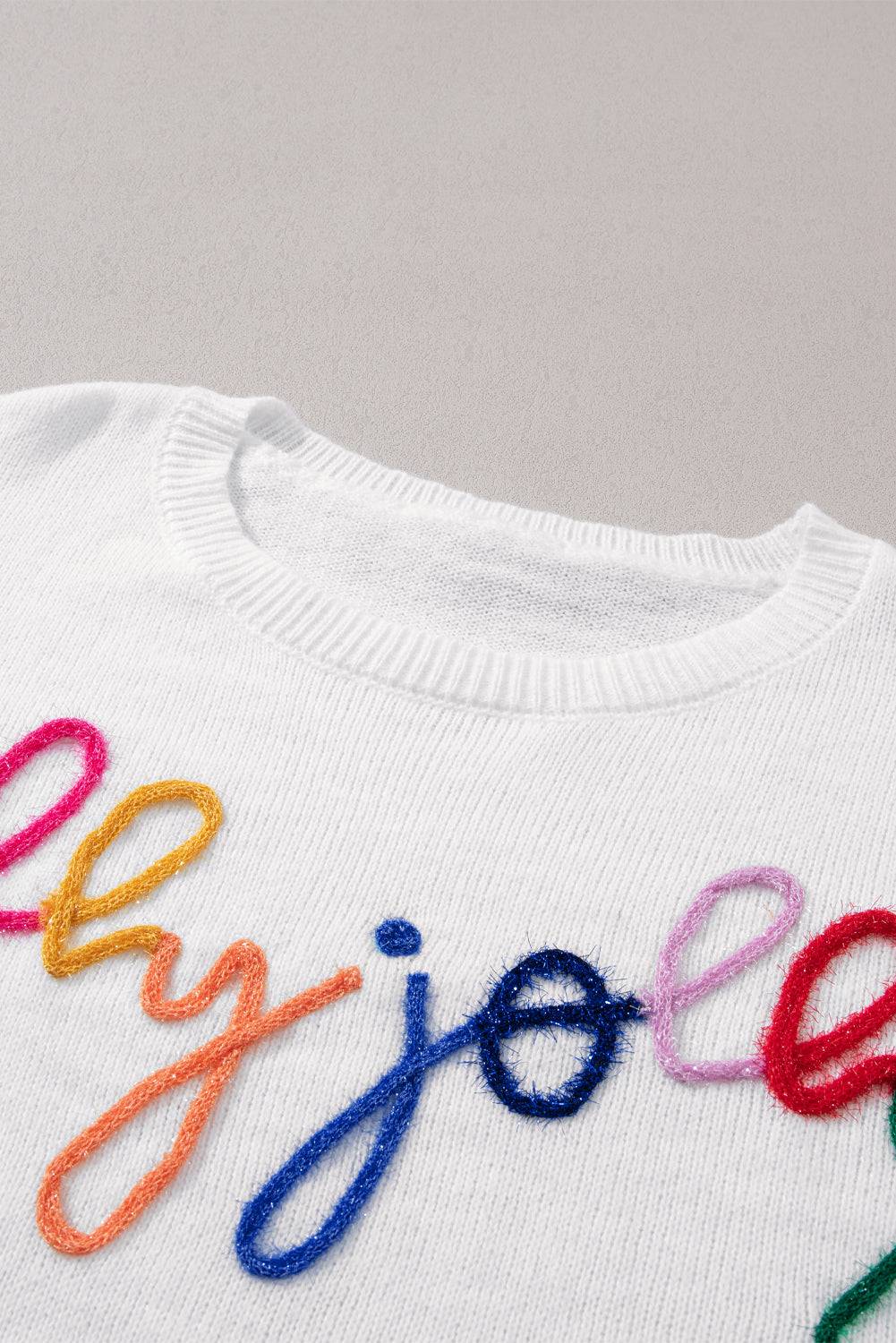 a white sweater with a colorful word on it