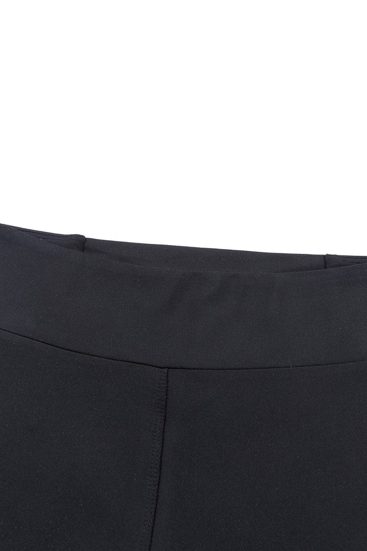 a close up of a person's black pants