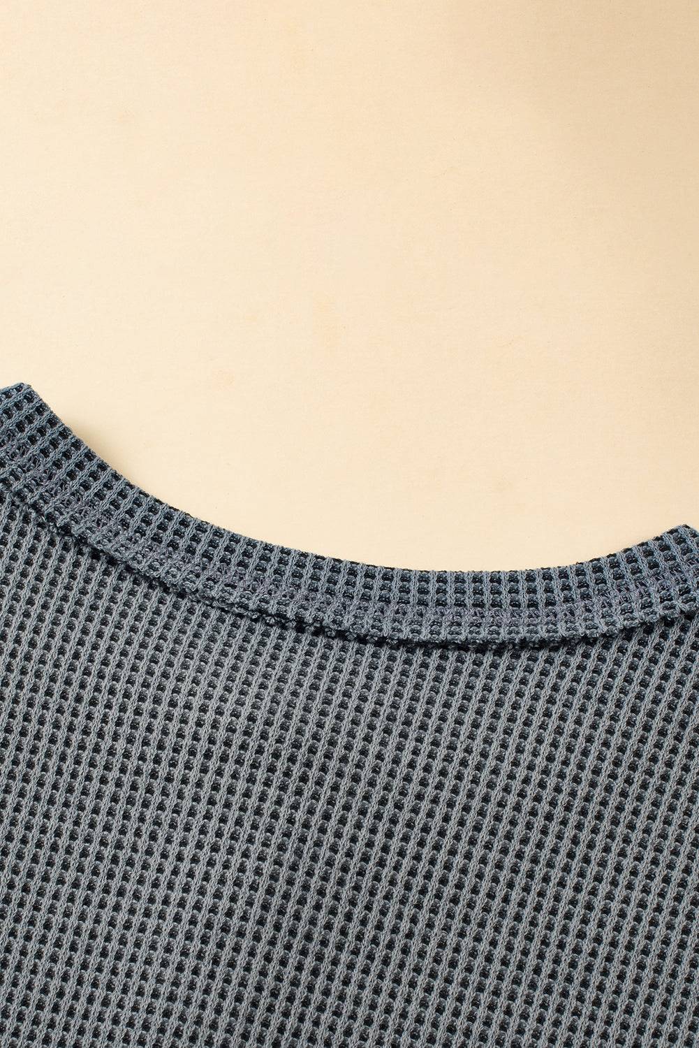a close up of a sweater on a table