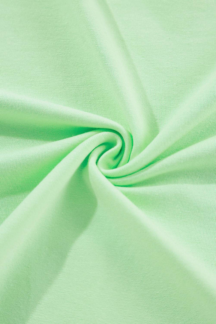 a close up shot of a light green fabric