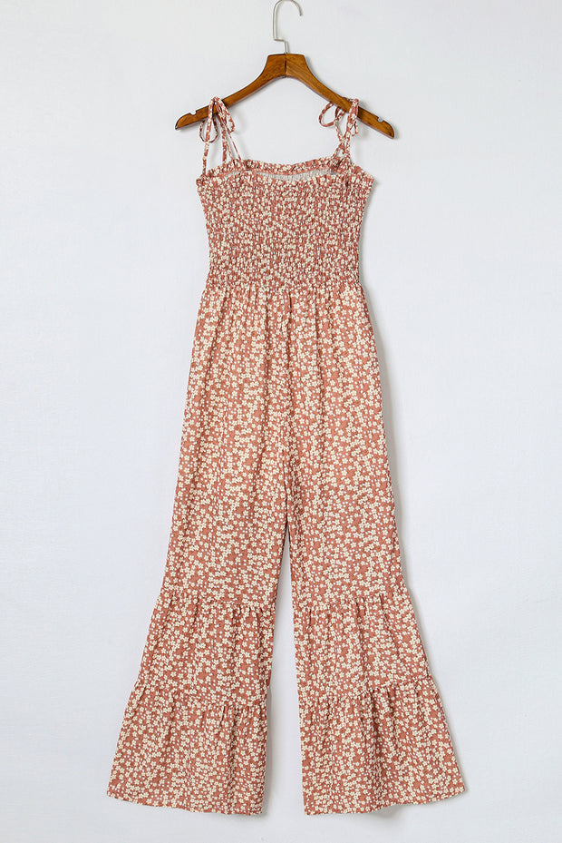 a women's jumpsuit hanging on a hanger