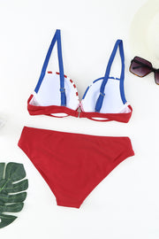 a red and white bikini with blue straps