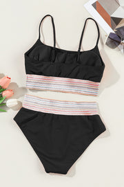 a black one piece swimsuit with multicolored straps