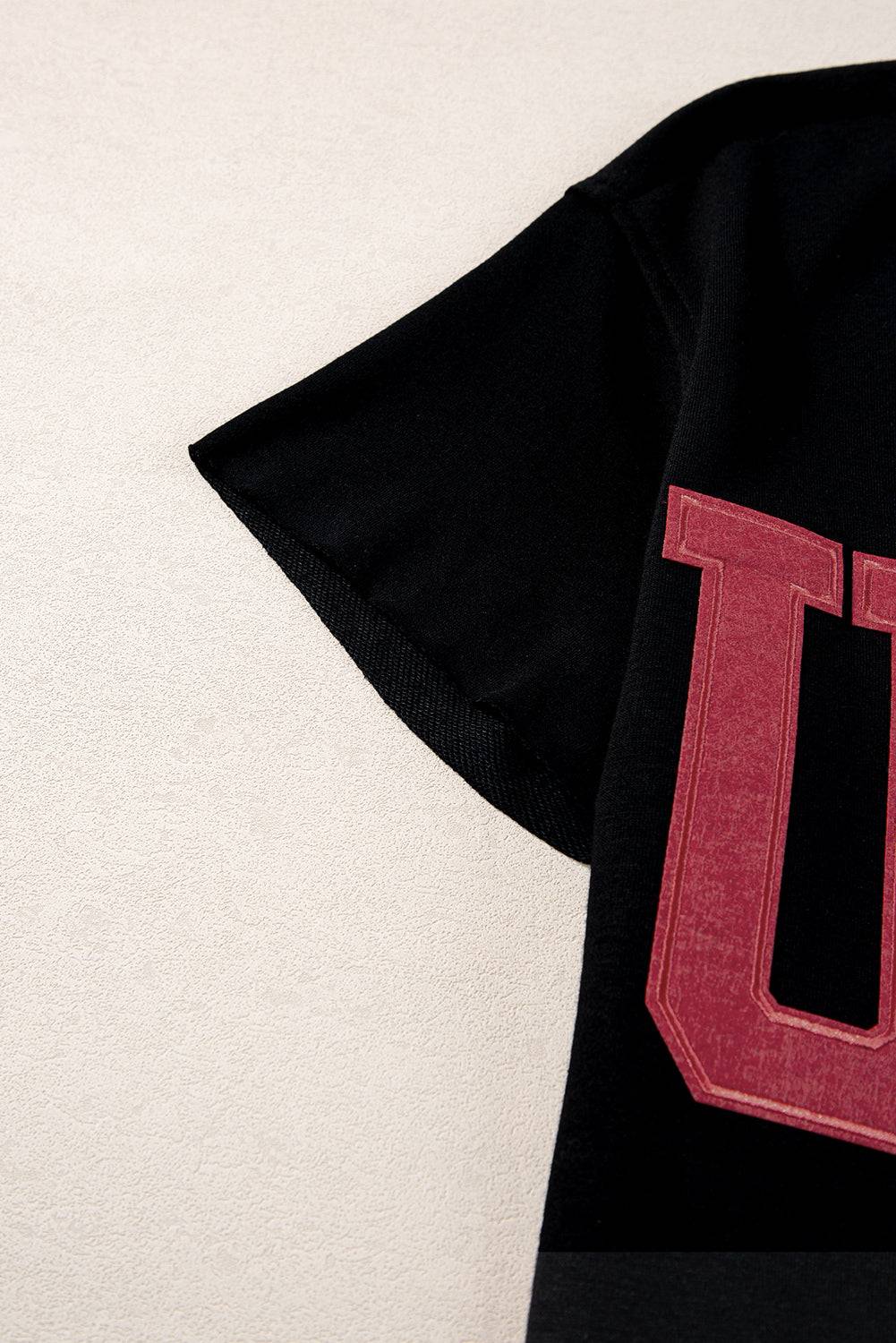 a black shirt with a red letter on it
