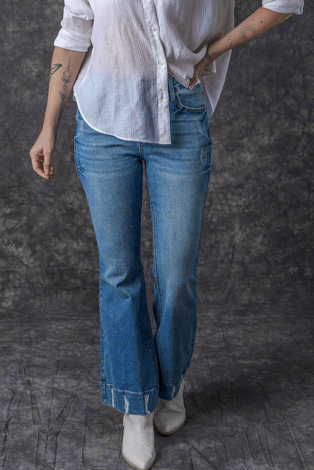 a woman in a white shirt and blue jeans