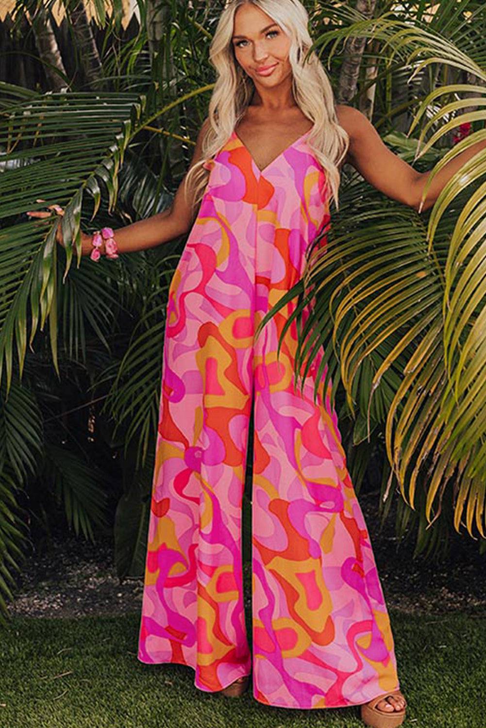 a woman standing in front of a palm tree