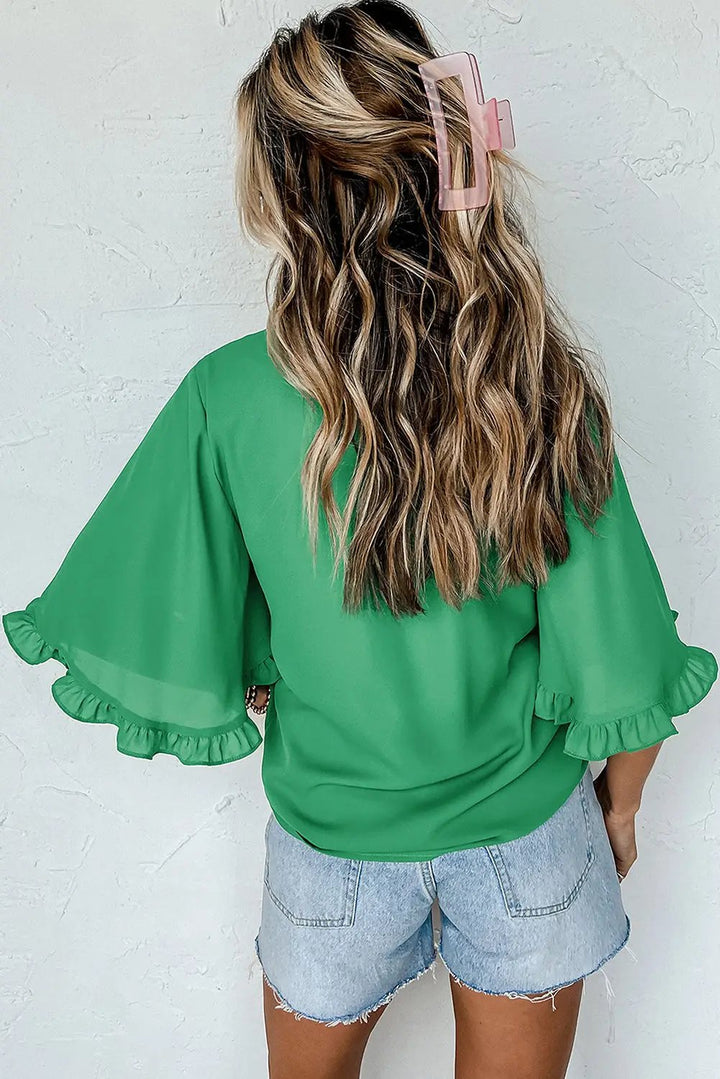 Back view of Green Frilly Round Neck Wide Half Sleeve Blouse showing ruffled sleeves and keyhole detail, ideal for daily wear.