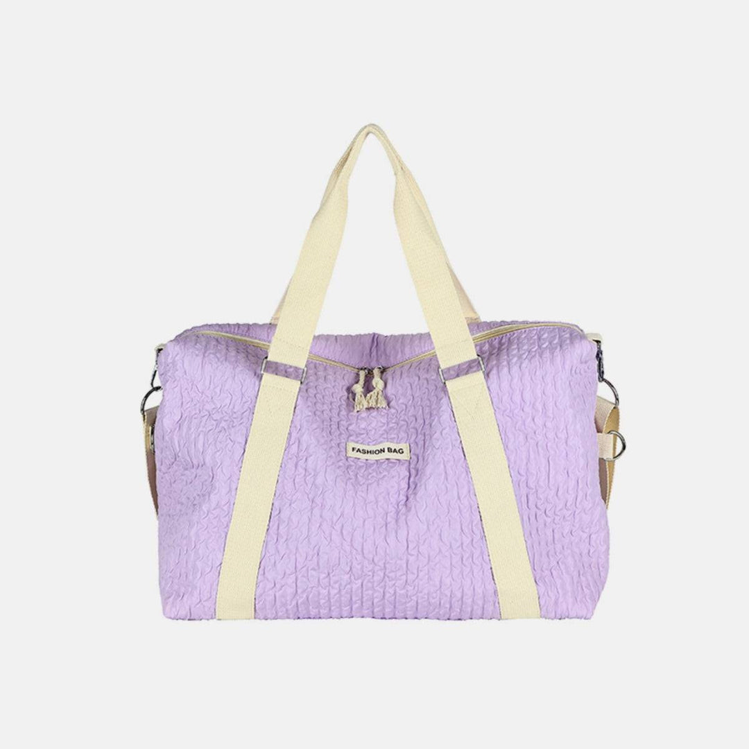 a purple bag with a yellow strap