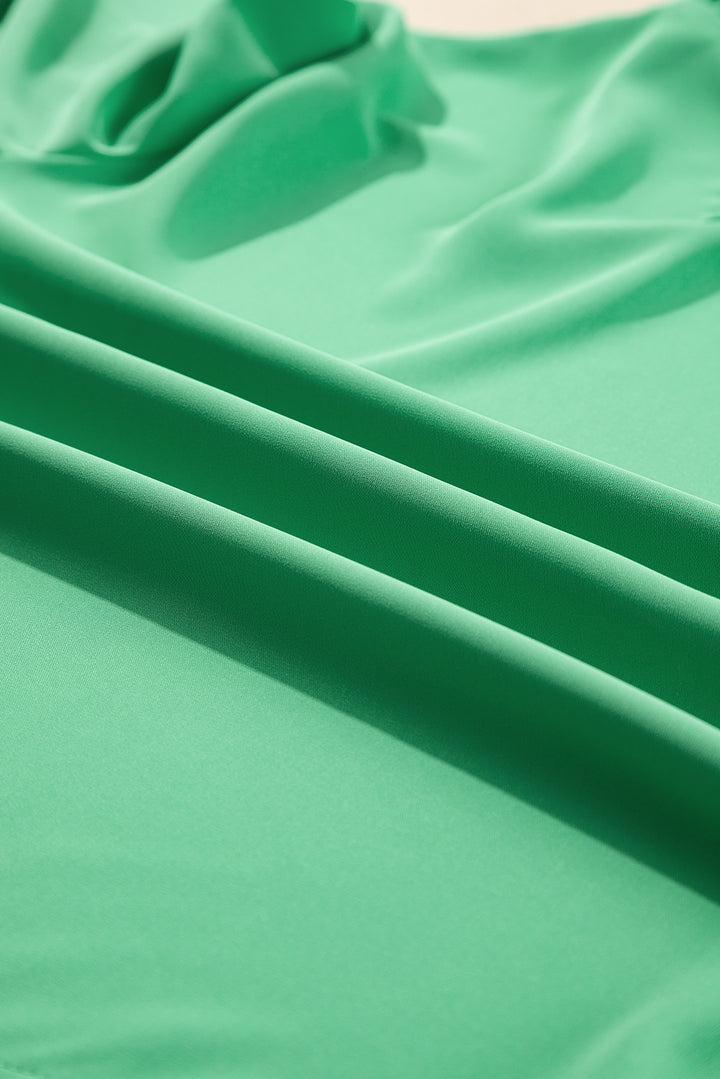 Fabric texture detail of Green Frilly Round Neck Wide Half Sleeve Blouse, showing soft and breathable material for comfort.