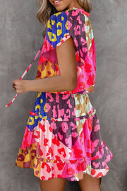 a woman in a colorful dress is posing for a picture