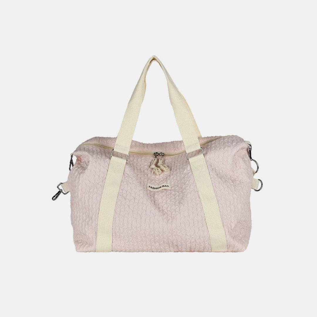 a pink and white handbag on a white background