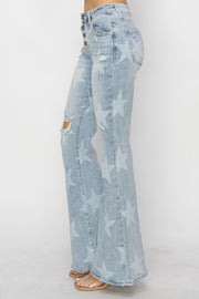 a woman wearing a pair of blue jeans with stars on them